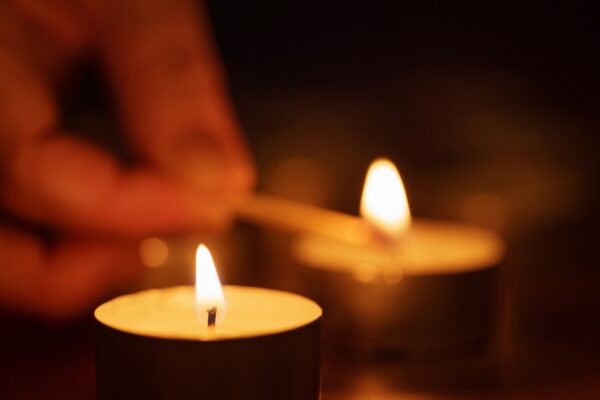 woman hand setting candle