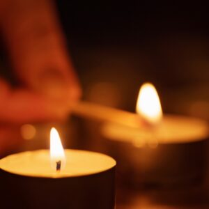 woman hand setting candle